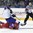 POPRAD, SLOVAKIA - APRIL 20: Slovakia's Pavol Regenda #11 falls over top of Russia's Georgi Dedov #2 during quarterfinal round action at the 2017 IIHF Ice Hockey U18 World Championship. (Photo by Andrea Cardin/HHOF-IIHF Images)


